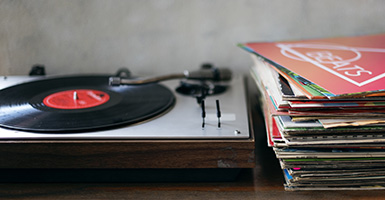 Vinyl record player and vinyl records on a table