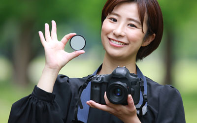 Woman holding a Camera Filter